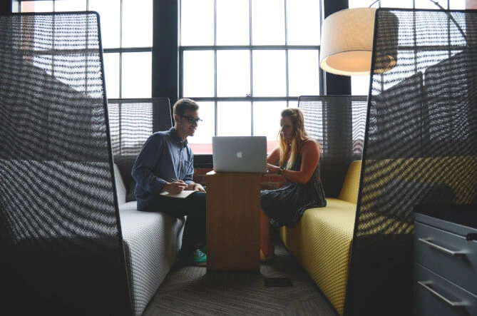 Person conducting interview to another person